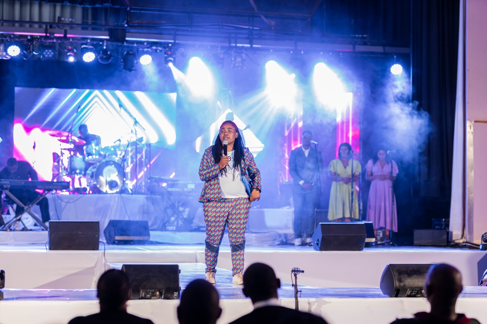 Thembi speaking on stage